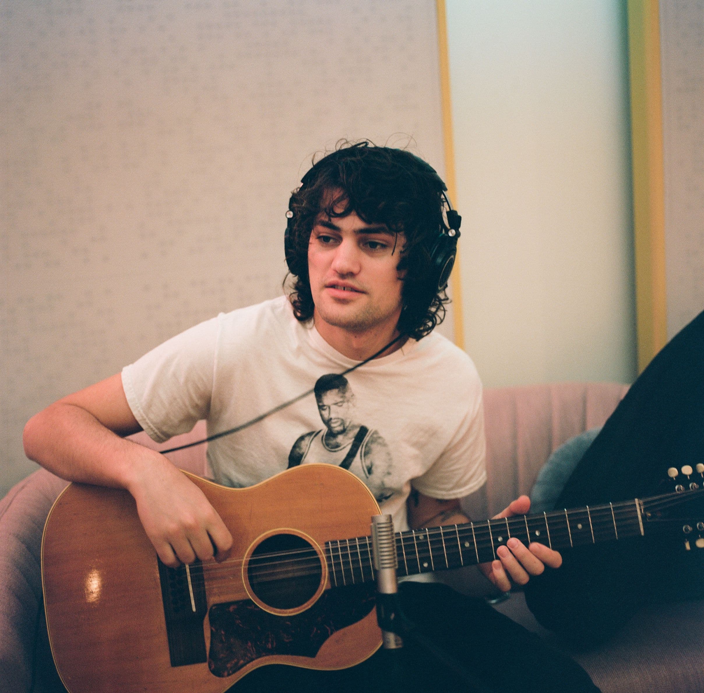 A man playing guitar.