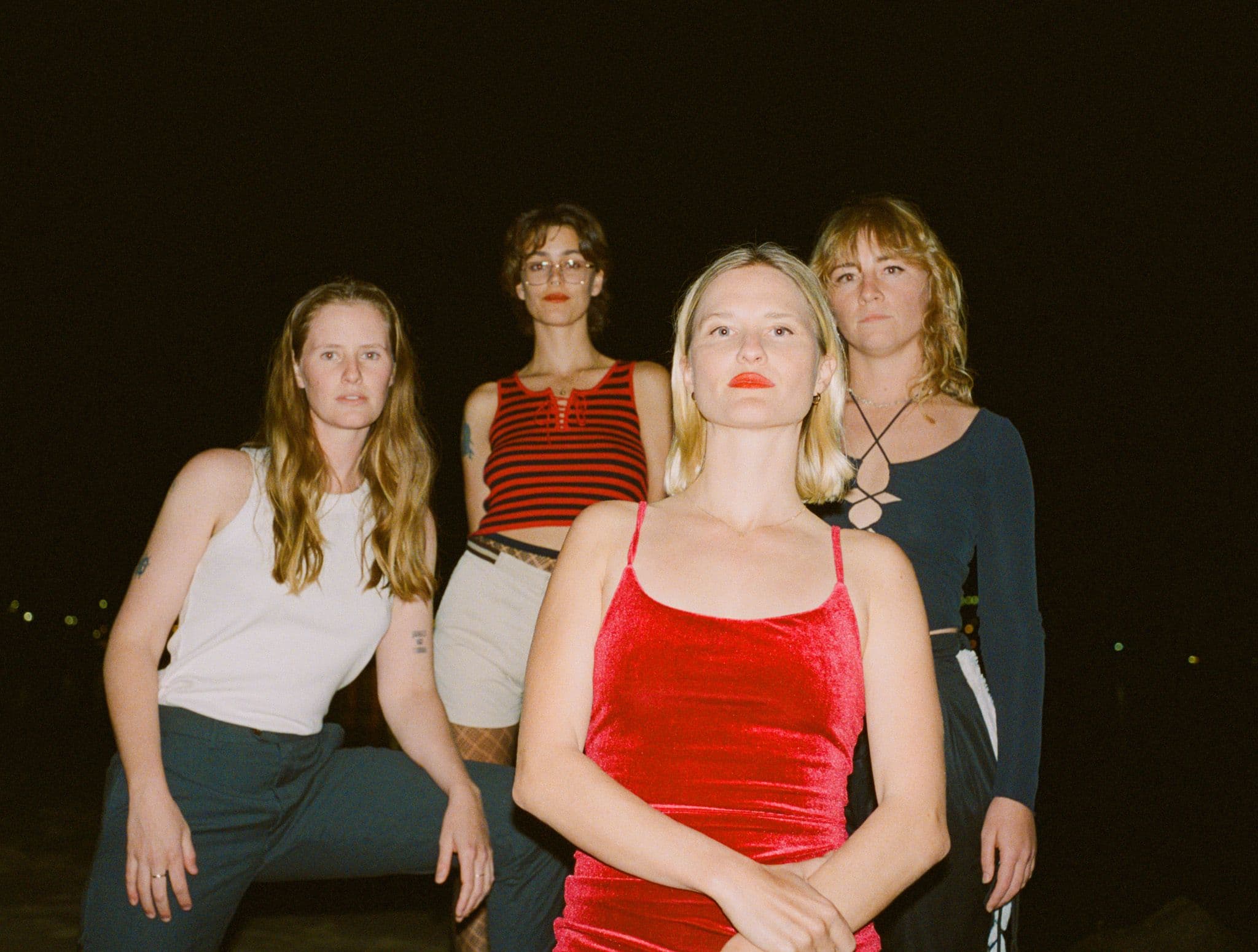 A group of women posting at night