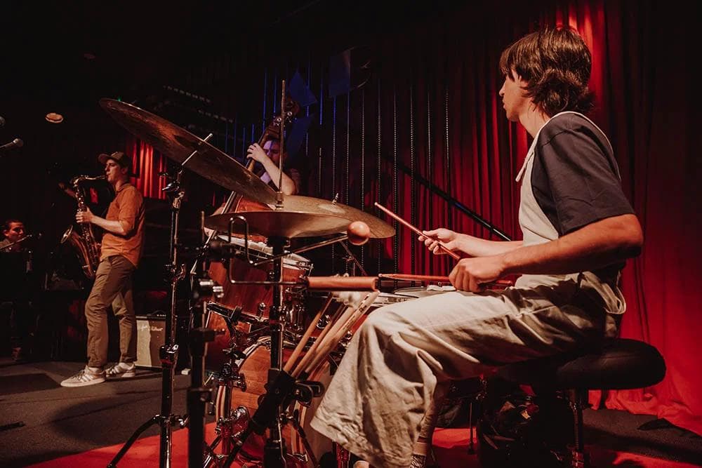 A drummer and saxaphonist playing live